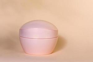Pink cosmetic container, mockup jar photo