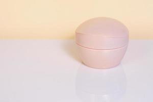 Pink cosmetic container, mockup jar photo