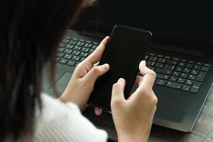 Cropped image of professional business woman working at home office via laptop, manager using portable computer device work process concept photo