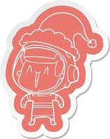 cartoon  sticker of a astronaut man wearing santa hat vector