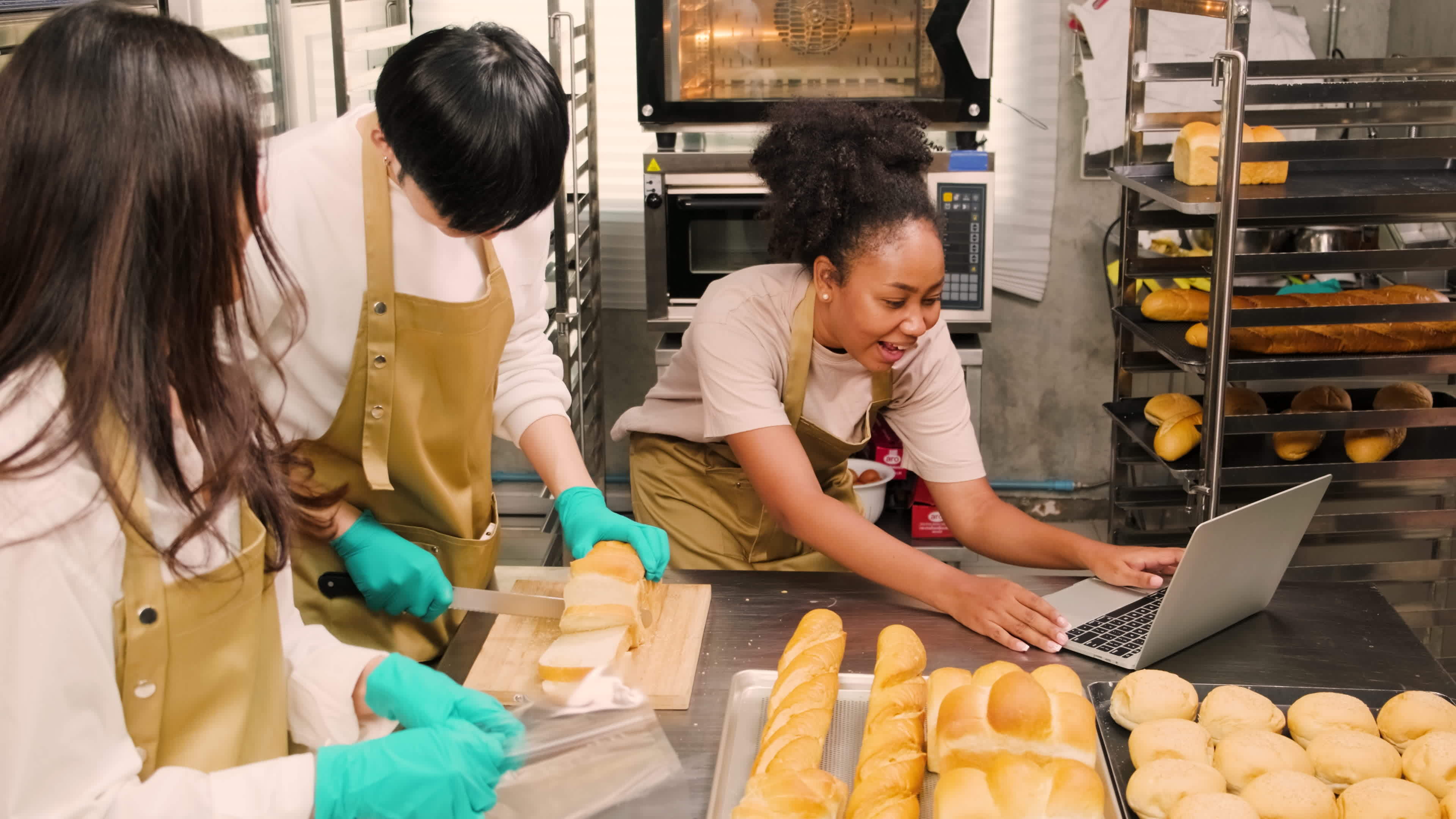 Three young friends and startup partners of bread dough and pastry