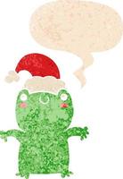 cute cartoon frog wearing christmas hat and speech bubble in retro textured style vector