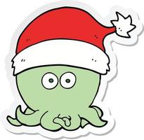 pegatina de un pulpo de dibujos animados con sombrero de navidad vector