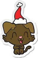 laughing sticker cartoon of a dog wearing santa hat vector