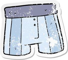 distressed sticker of a cartoon boxer shorts vector