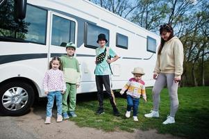 Mother with four children travel at motorhome RV camper van. photo