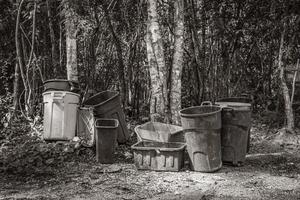 Trash waste garbage cans in the jungle in Mexico. photo