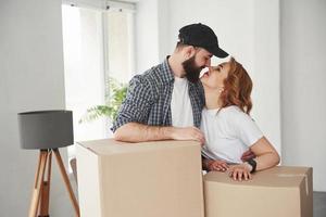 You are awesome. Happy couple together in their new house. Conception of moving photo