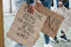 Cropped photo. Group of feminist women have protest for their rights outdoors photo