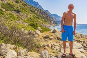 Young traveler hiker with natural coastal landscapes on Kos Greece. photo