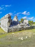 Ancient Tulum ruins Mayan site temple pyramids artifacts seascape Mexico. photo