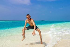 Funny tourist enjoys vacation on island Madivaru Finolhu Rasdhoo Maldives. photo