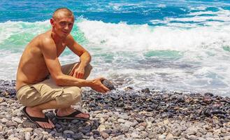Young male model at Playa de las Americas Tenerife Africa. photo