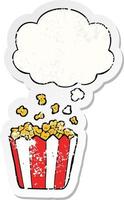 cartoon popcorn and thought bubble as a distressed worn sticker vector