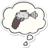 cartoon ray gun and thought bubble as a printed sticker vector