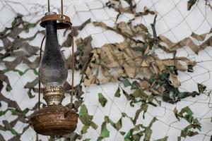 military background, kerosene lamp photo