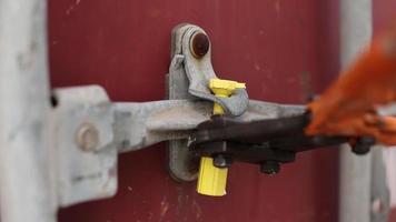 Opening the container seal. The docker opens the container and checks its contents. Checking the gaskets. video