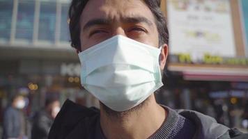 Portrait of man in surgical mask. everyday life. Dark-skinned man. People waiting. Tiring life. video