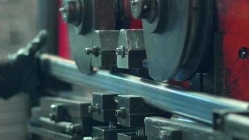A bending machine operator bends a sheet metal workpiece on a CNC machine, close-up. video