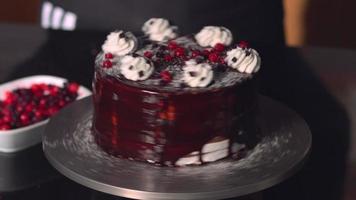 Rotating cake. Fruity cake prepared by a pastry master. A delicious looking chocolate cake. video