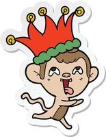 sticker of a crazy cartoon monkey wearing jester hat vector