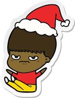 sticker cartoon of a boy wearing santa hat vector