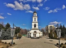 Republic of Moldova, city Chisinau, 2022 - Bell tower and in the background Cathedral of the Nativity of Christ. photo