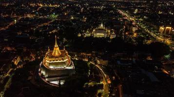 Golden Mountain  Wat Saket Ratcha Wora Maha Wihan popular Bangkok tourist attraction , Landmarks of bangkok Thailand . In the rain before , topview photo