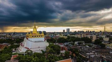 Golden Mountain  Wat Saket Ratcha Wora Maha Wihan popular Bangkok tourist attraction , Landmarks of bangkok Thailand . In the rain before , topview photo