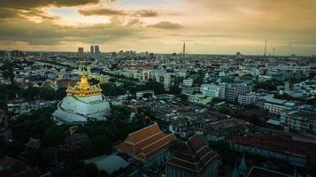 Golden Mountain  Wat Saket Ratcha Wora Maha Wihan popular Bangkok tourist attraction , Landmarks of bangkok Thailand . In the rain before , topview photo