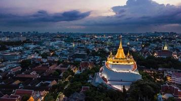 Golden Mountain  Wat Saket Ratcha Wora Maha Wihan popular Bangkok tourist attraction , Landmarks of bangkok Thailand . In the rain before , topview photo