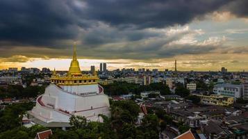 Golden Mountain  Wat Saket Ratcha Wora Maha Wihan popular Bangkok tourist attraction , Landmarks of bangkok Thailand . In the rain before , topview photo