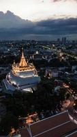 Golden Mountain  Wat Saket Ratcha Wora Maha Wihan popular Bangkok tourist attraction , Landmarks of bangkok Thailand . In the rain before , topview photo