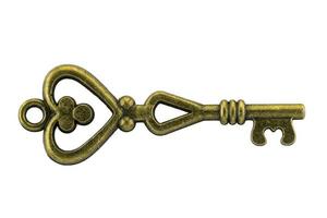 llave vintage llave dorada antigua en el camino de recorte de fondo blanco foto