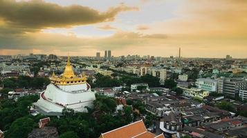 Golden Mountain  Wat Saket Ratcha Wora Maha Wihan popular Bangkok tourist attraction , Landmarks of bangkok Thailand . In the rain before , topview photo