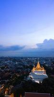 Golden Mountain  Wat Saket Ratcha Wora Maha Wihan popular Bangkok tourist attraction , Landmarks of bangkok Thailand . In the rain before , topview photo