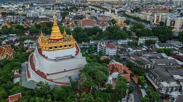 Golden Mountain  Wat Saket Ratcha Wora Maha Wihan popular Bangkok tourist attraction , Landmarks of bangkok Thailand . In the rain before , topview photo