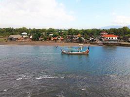 Beautiful aerial view- Fishing boats crossing the beach in Bali -Indonesia photo