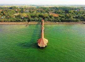 Aerial view, waves at the pier - Pangandaran beach photo