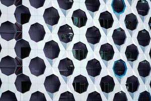 Ventilation panel on the facade of the building. rainscreen. exterior wall. Blue white perforated panels. Metallic modern design photo