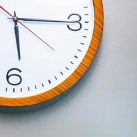 Old wall clock made of wood and iron. The big one was taken out at some point. to see some needles and symbols Focus on some points, cinematic tones, shot in the studio. photo