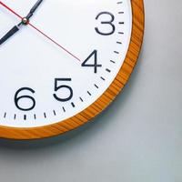 Old wall clock made of wood and iron. The big one was taken out at some point. to see some needles and symbols Focus on some points, cinematic tones, shot in the studio. photo