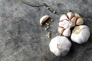 Still life of Garlic cloves raw food on old table backgrounds above photo