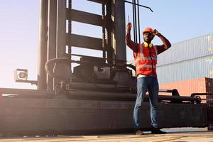 African-American male engineers use radio communication to communicate efficiently in industrial factories. photo