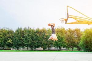 Performance of a white basketball player in the field of road photo