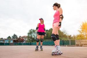 Sporty girls in golf rollerblade photo