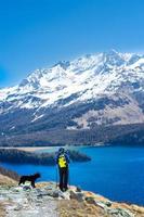 Girl in hiking mountain with her faithful dog photo