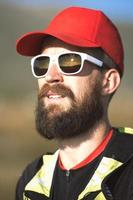 Portrait of a young adventurous sporty man with beard photo