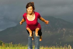 Positions Acroyoga girl of male in nature in the mountains photo