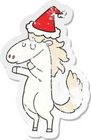 distressed sticker cartoon of a horse wearing santa hat